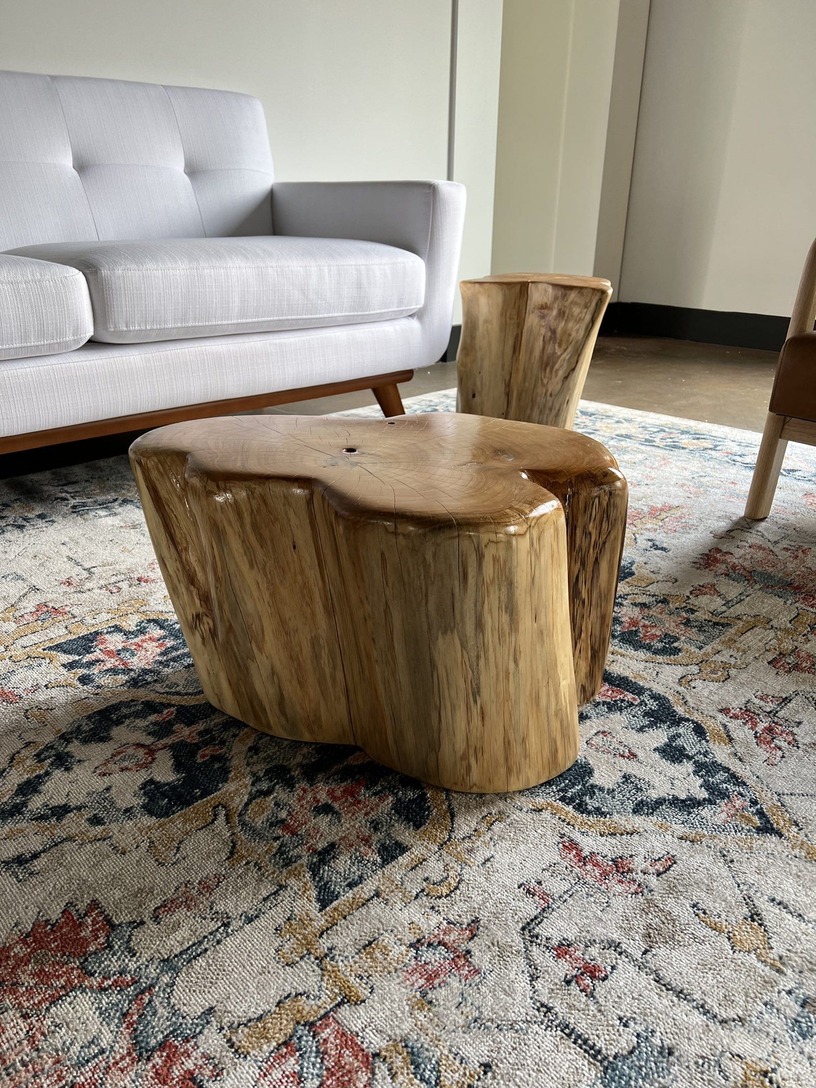 Sculpted stump coffee table, styled living room